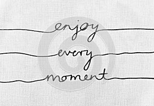 White canvas texture with text enjoy every moment life quotes