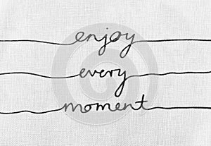 White canvas texture with text enjoy every moment life quotes photo