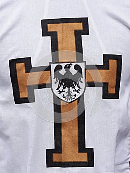 White cape with Teutonic cross