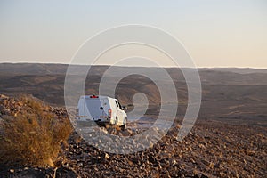 WHITE Car drivE in desert on white sky background. Extreme activity. Travel, travelling. Summer vacation