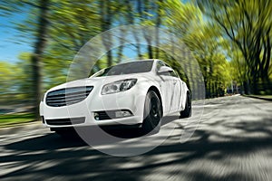 White car fast drive on asphalt road