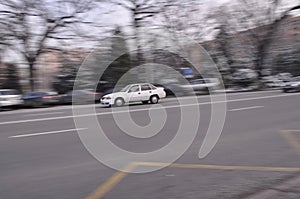 White car in motion on the road