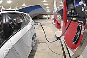 White car at a petrol station