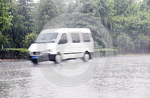 White car in the rain