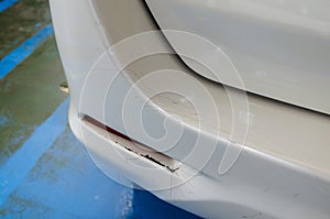 White car rear bumper cracks