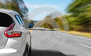 A white car on the road.