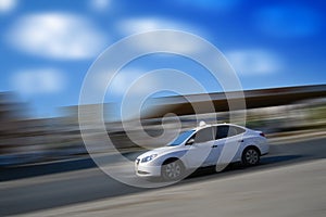 White car speeding with motion blur