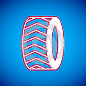 White Car tire wheel icon isolated on blue background. Vector