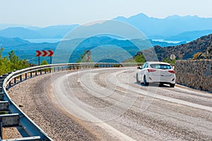 White car in turn a road