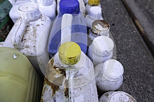 White carafes in the trash