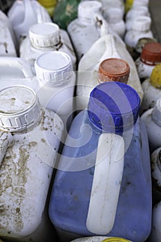 White carafes in the trash