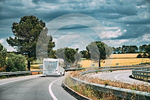 White Caravan Motorhome Car Goes On Highway Road