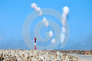 White carbon fiber clouds in blue sky hiding naval destroyers from anti-ship missiles, military show