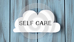 White card in cloud shape with text Self Care