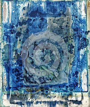 White card coated with cyanotype chemistry over multiple uses photo