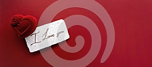 White card with congratulations and ring case on a red background. Valentine day card