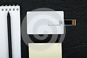 White card. Office desk wooden background top view mock up