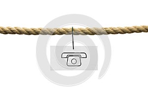 White card with phone symbol hanging by wire from a rope isolate