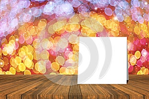 White card put on table and blurred bokeh out of focus in christmas night light background. product display template.