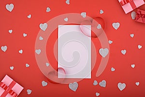 White card on a red background from hearts. Concept for valentines day