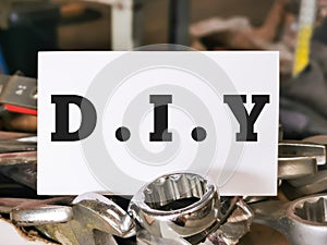 White card written D.I.Y stack on tools.