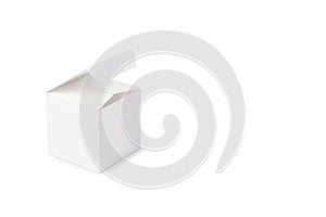 A white cardboard box on a white background on th left. Box mock-up.