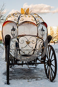 The white carriage with wrought iron elements