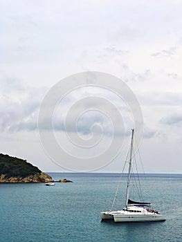White catamaran moored in mediterranean sea