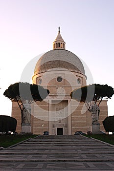 white cathedral seen from the bottom of a staircase