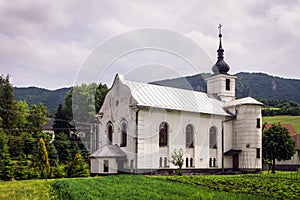 White Catholic church against the rocks in Slovakia