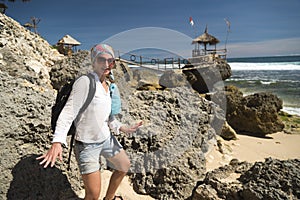 White caucasian girl having fun at the gazebo near ocean