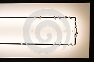 White ceiling with black frame and electric reflectors