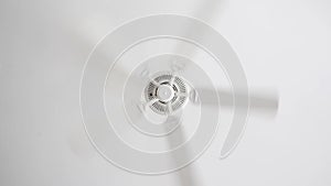 White ceiling electrical fan in motion