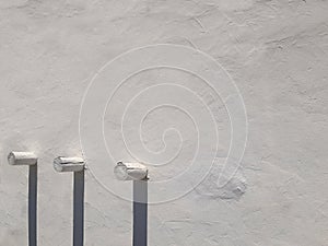 White cement background with wooden piles. Textures and Full frame of architecture and construction