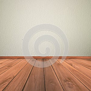 White cement plaster wall and wood floor photo