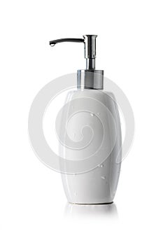 white ceramic bottle with dispenser pump for liquid soap, shampoo or gel isolated on white