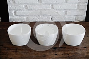 White ceramic bowl on the wood table