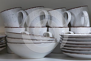 white ceramic bowls and cups of coffee