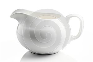 A white ceramic creamer pitcher with a handle and a spout, shiny and smooth, on a plain white background