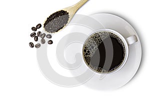 White ceramic cup of black coffee and instant coffee powder in wooden spoon with coffe beans isolated on white background.