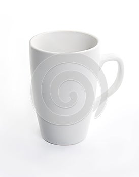 White ceramic cup on white background