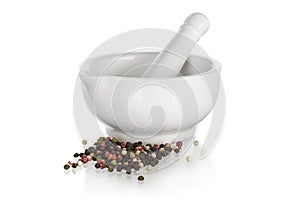 White ceramic mortar with pepper
