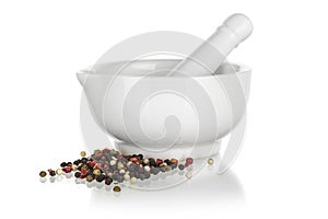 White ceramic mortar with pepper