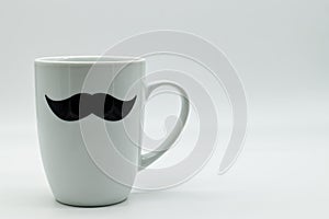 White ceramic mug decorated with black male mustache