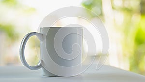 White ceramic mug on natural light
