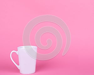 White ceramic mug on pink background, relax, cancer, mother`s and women`s day.