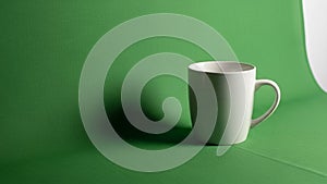 A simple design with a smooth surface and a curved handle on the right