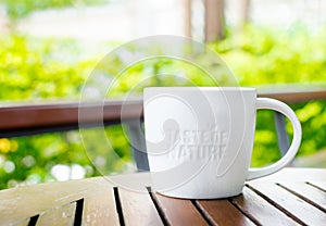 White ceramic mug with stamp word