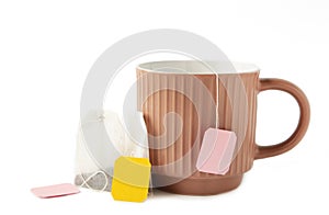 White ceramic mug with teabag label isolated on a white