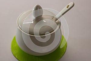 White ceramic mustard pot.